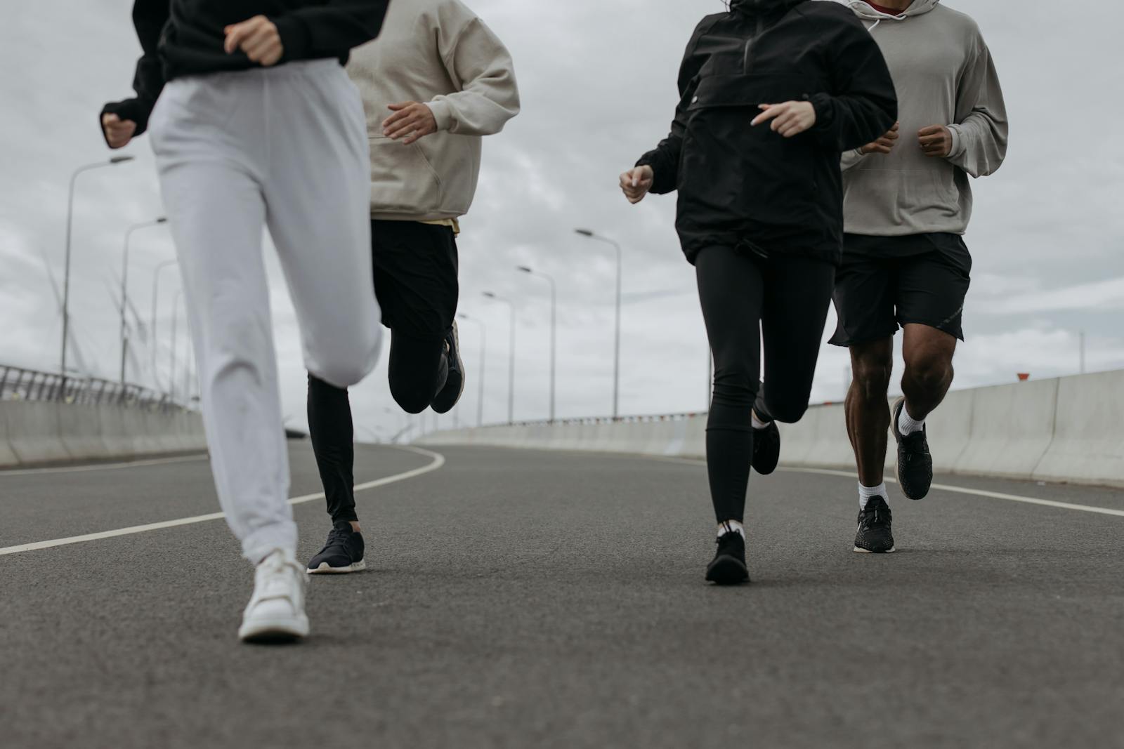 A People Jugging Together on a Road